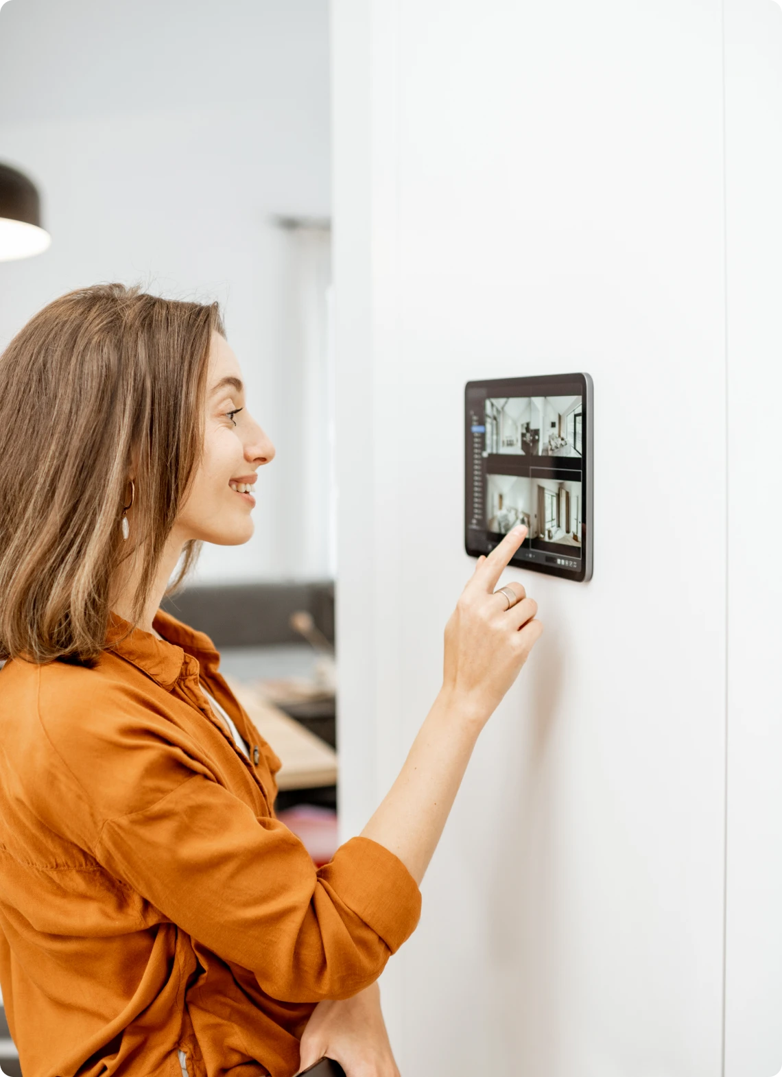 Woman using smart home control panel
